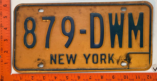 1973 base New York #879-DWM Passenger License Plate