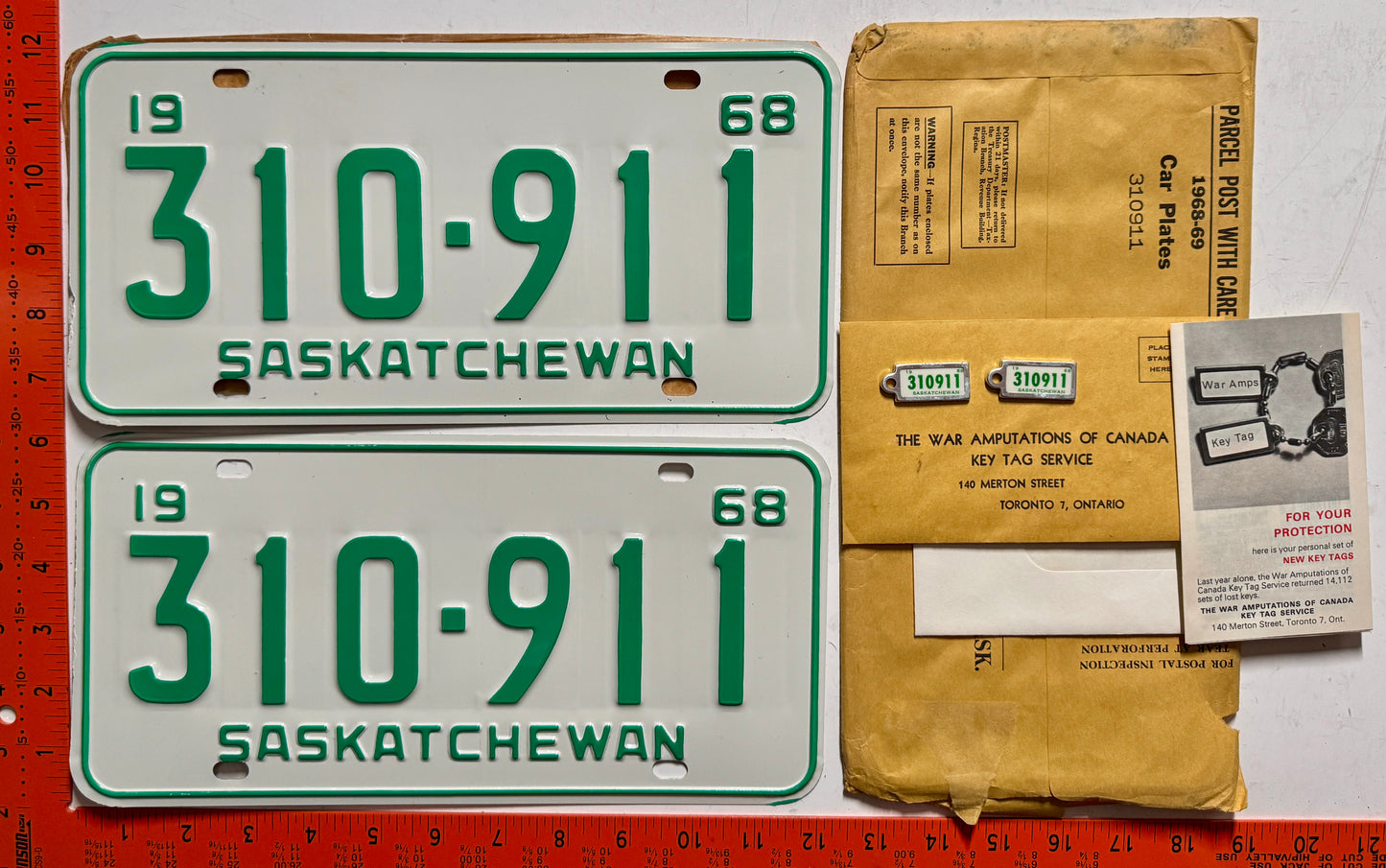 1968 Saskatchewan #310-911 Passenger License Plate Pair w/keychain tags