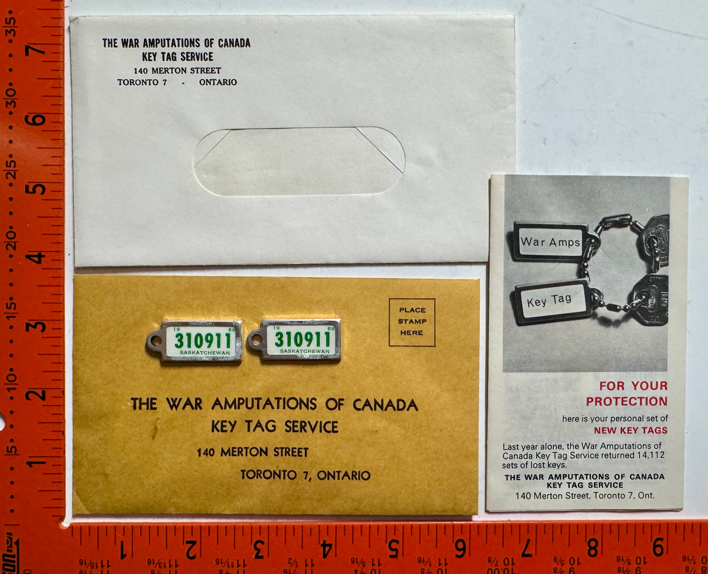 1968 Saskatchewan #310-911 Passenger License Plate Pair w/keychain tags